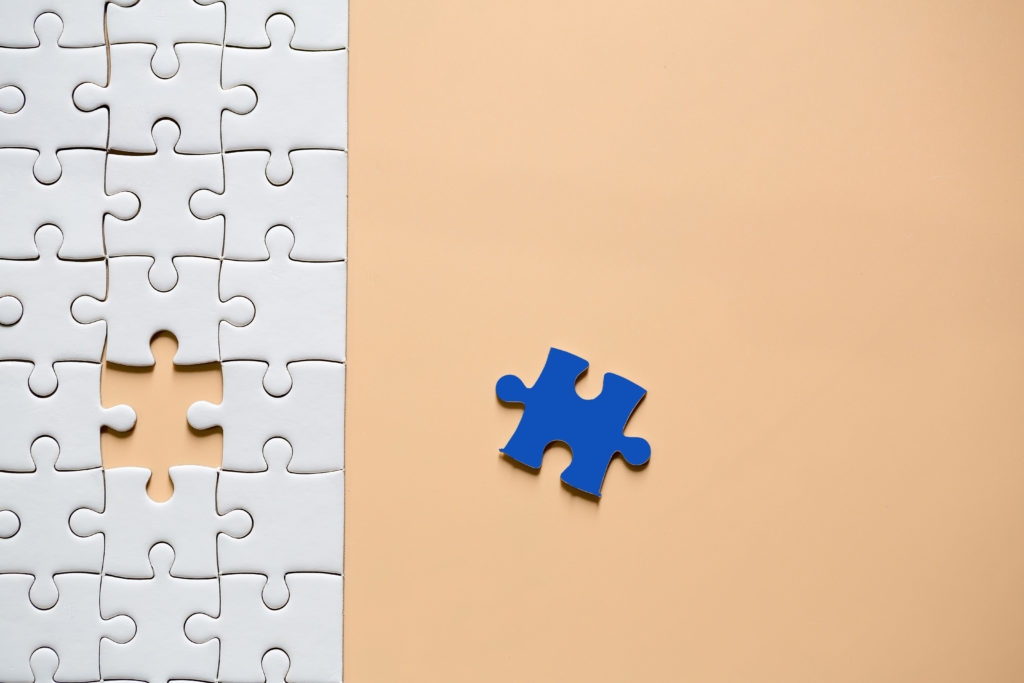 Unfinished jigsaw puzzle representing trusted industry partnerships